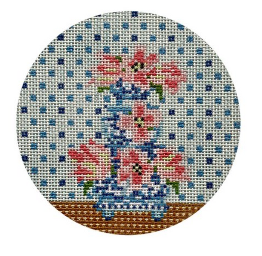 The Stitching Garden for Plum Stitchery round needlepoint canvas of tulips in a tiered vase with a blue polka dot background
