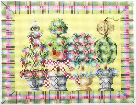 Kelly Clark needlepoint canvas of four topiaries with bright plaid border