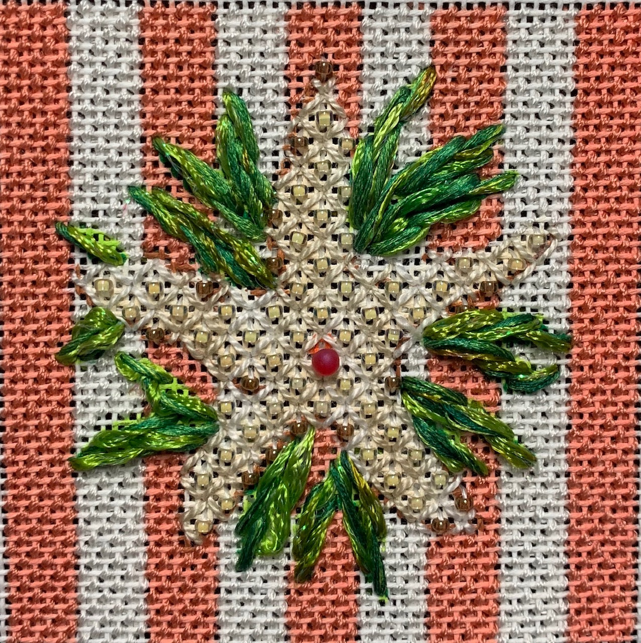 Stitched example of the preppy Kate Dickerson starfish insert canvas on a peach and white striped background - sized for self-finishing boxes