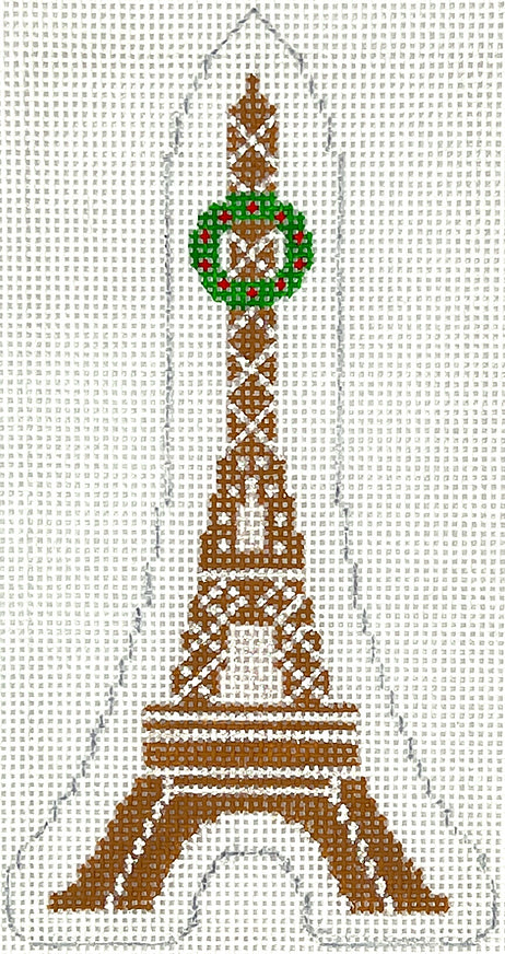 Kate Dickerson Christmas needlepoint canvas of the Eiffel Tower in Paris, France made of gingerbread with a Christmas wreath as decoration