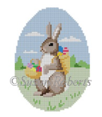 Susan Roberts Easter egg shaped needlepoint canvas of a bunny rabbit carrying a basket of dyed eggs