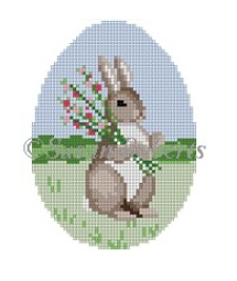 Susan Roberts easter egg shaped needlepoint canvas of a bunny rabbit holding a bouquet of flowers