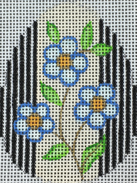 Amanda Lawford Easter egg shaped needlepoint canvas with forget me not flowers and black and white stripes
