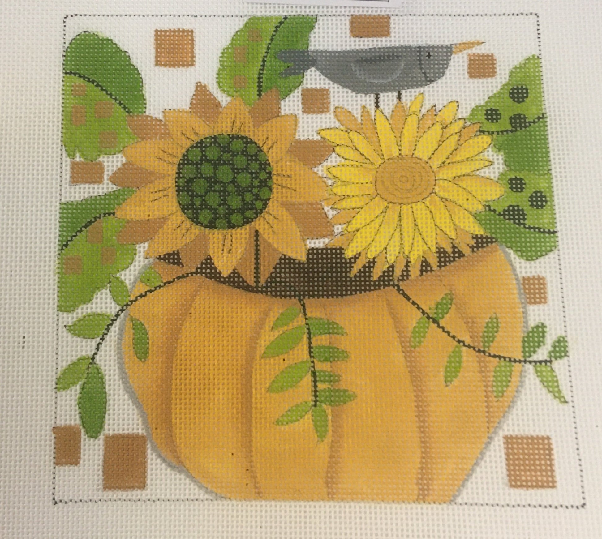Ditto! Needlepoint Works needlepoint canvas of a pumpkin holding sunflowers