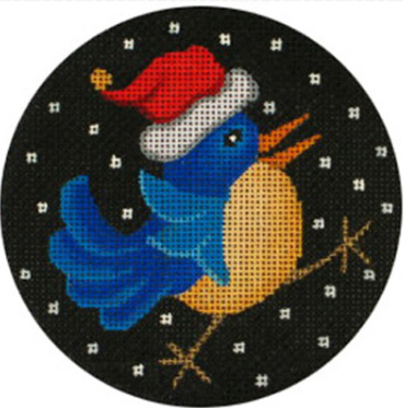 Amanda Lawford round needlepoint canvas Christmas ornament of a whimsical blue bird wearing a santa hat with snow