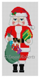 Susan Roberts needlepoint canvas of a Santa nutcracker holding a bag of presents and a gift