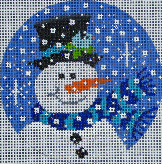 Vallerie Needlepoint Gallery round winter needlepoint canvas of a snowman wearing a blue scarf with a top hat and a bird in the snow