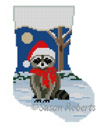 Susan Roberts mini sock needlepoint canvas of a raccoon in the snow at night wearing a Santa hat
