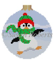 Susan Roberts Christmas ornament needlepoint canvas (round with ball top) of a whimsical dancing penguin wearing a hat and a scarf