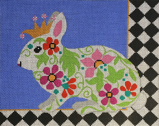 Amanda Lawford needlepoint canvas of a floral bunny rabbit wearing a crown with a bold black and white harlequin border