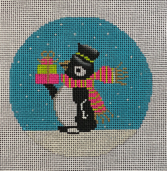 Amanda Lawford and Vallerie Needlepoint Gallery bright and whimsical round needlepoint canvas of a penguin wearing a pink and green scarf and a top hat and presents with a snowy background