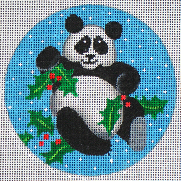 DC designs round needlepoint canvas of a panda holding holly leaves on a snowy background