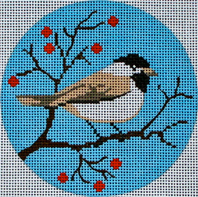 DC designs round needlepoint canvas of a chickadee bird on a winter branch with berries