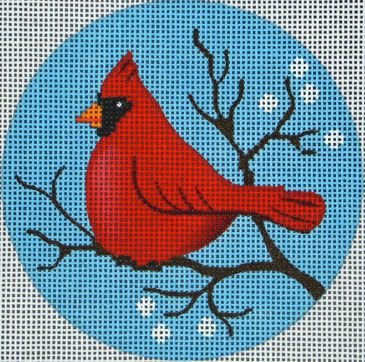 DC designs round needlepoint canvas of a cardinal on a winter tree branch with snow