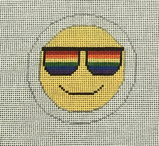 Sew Much Fun needlepoint canvas of the sunglasses emoji with LGBTQIA+ rainbow pride striped sunglasses