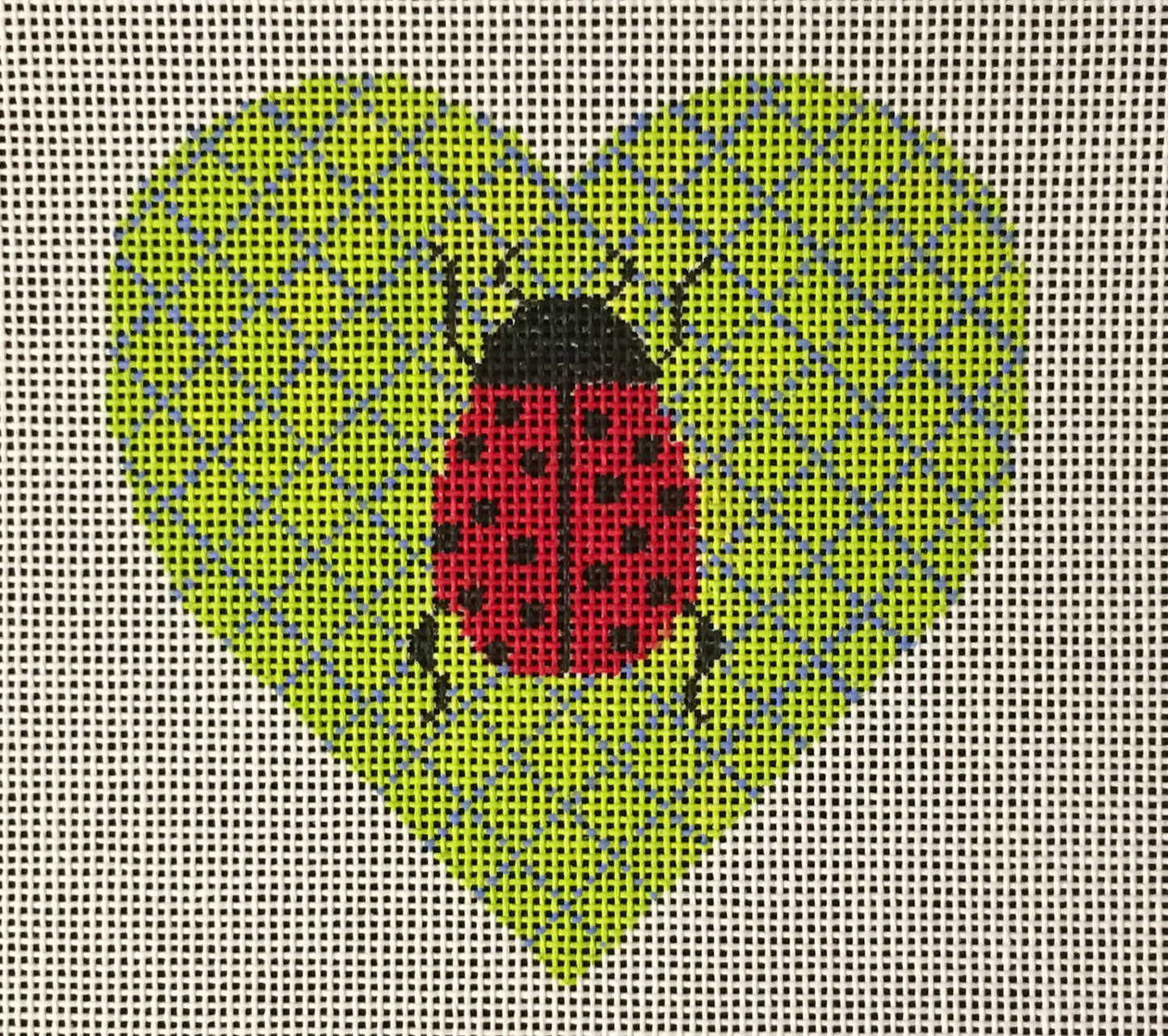 Vallerie Needlepoint Gallery heart needlepoint canvas of a ladybug on a green geometric background