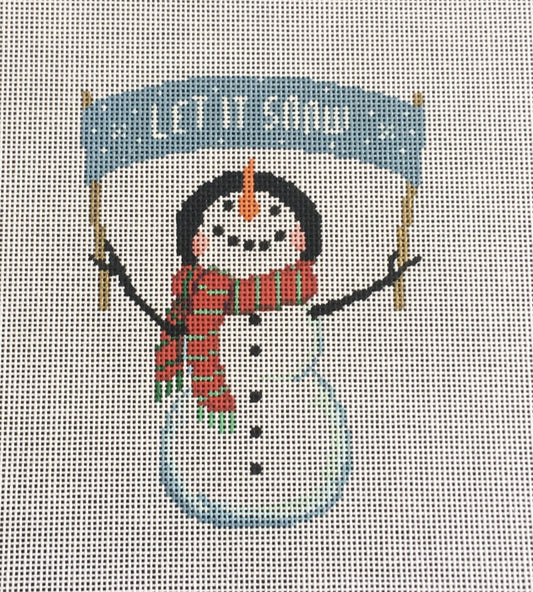 Susan Roberts needlepoint canvas of a snowman wearing a hat and scarf holding a banner that says "Let it snow"