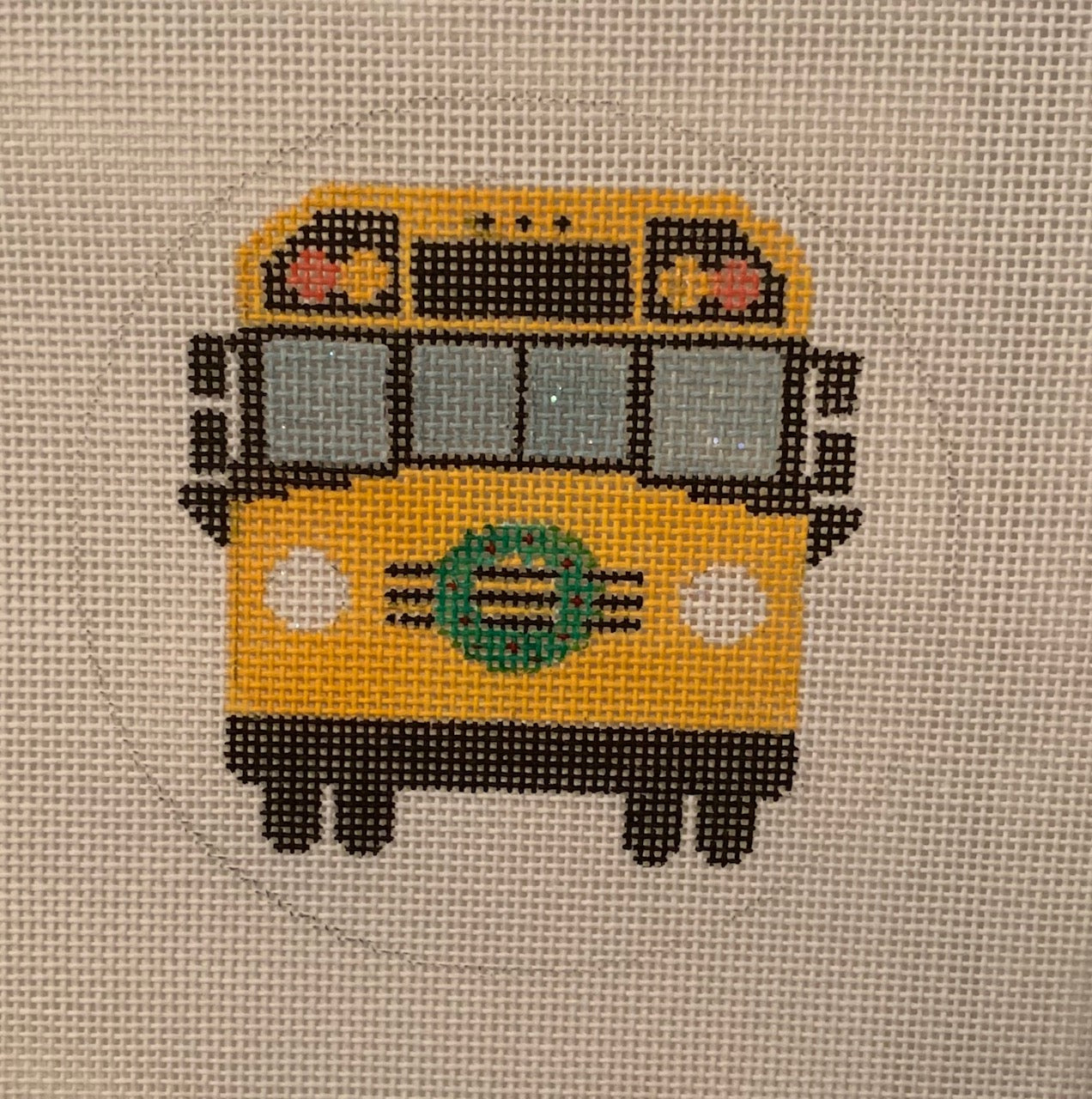 Vallerie Needlepoint Gallery round Christmas ornament needlepoint canvas of a school bus with a wreath on the front