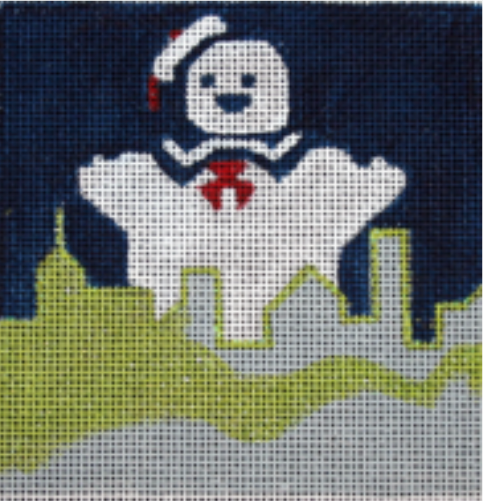 Melissa Prince movie coaster needlepoint canvas of the Staypuft marshmallow man from Ghostbusters over a green and gray New York City skyline