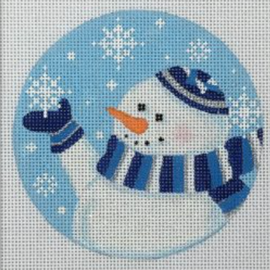 Pepperberry round needlepoint canvas of a snowman wearing blue and white mittens and scarf and a blue yarmulke reaching out and holding a snowflake