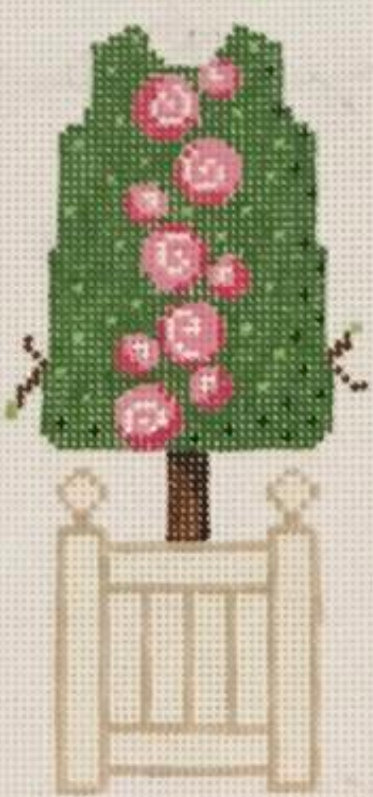 Rachel Donley and Two Sisters collaboration needlepoint canvas of a topiary shaped like a Two Sisters mini shift dress with roses in a vertical line down the center