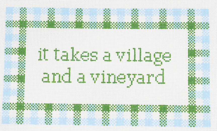 Wipstitch Needleworks needlepoint canvas of the saying "it takes a village and a vineyard" with a plaid background