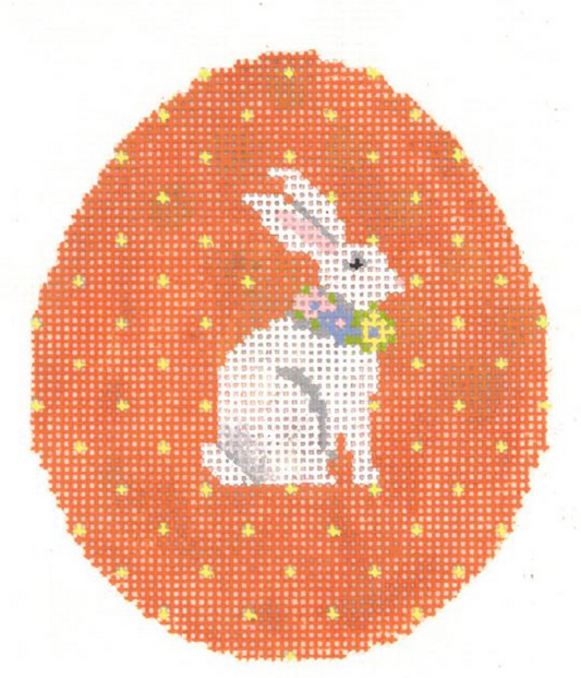 Kelly Clark and Colonial Needle needlepoint canvas of an orange easter egg with tiny yellow pin polka dots and a bunny rabbit wearing a flower wreath as a necklace