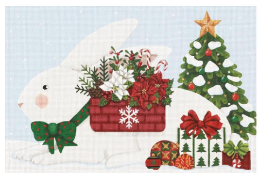 Melissa Shirley needlepoint canvas of a white bunny rabbit with a basket of poinsettias and a green bow tie with a Christmas tree in the background and presents and ornaments next to the rabbit