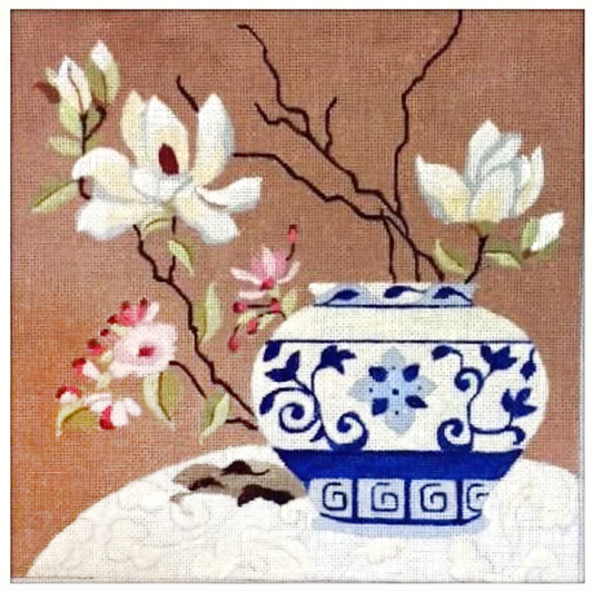 Melissa Prince needlepoint canvas of flowers in a blue and white vase on a lace tablecloth