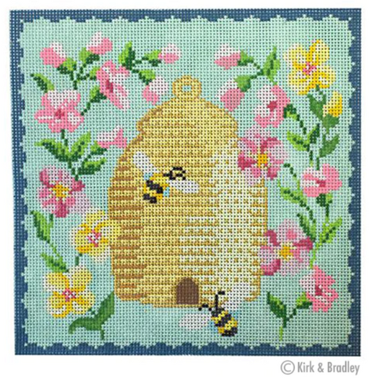 Kirk and Bradley needlepoint canvas of a bee skep with bumblebees and pink and yellow flowers