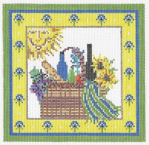 Kelly Clark needlepoint canvas of a picnic basket with a French baguette bread and wine with a smiling sun and a Provence French country border