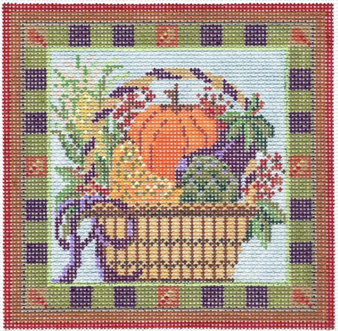 Kelly Clark needlepoint canvas of a fall basket with pumpkin, artichoke, and eggplant with a striped border