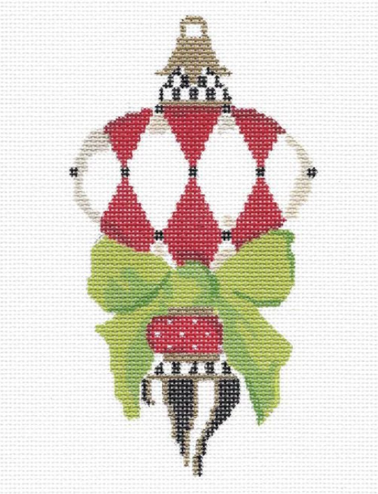 Kelly Clark Christmas needlepoint canvas of a Victorian ornament with red and white harlequin diamonds and a green bow