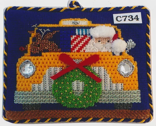 Princess and Me needlepoint canvas with stitch guide of a Santa driving a New York City taxi cab with Rudolph the reindeer and presents and a wreath
