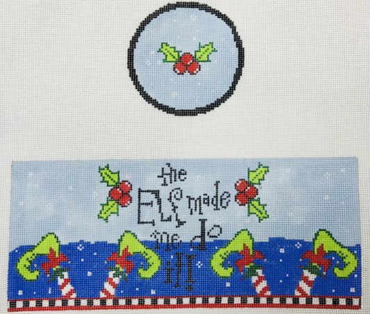 Funda Scully needlepoint canvas for a round hinged box with holly on the lid and the phrase "the elf made me do it" and elf shoes