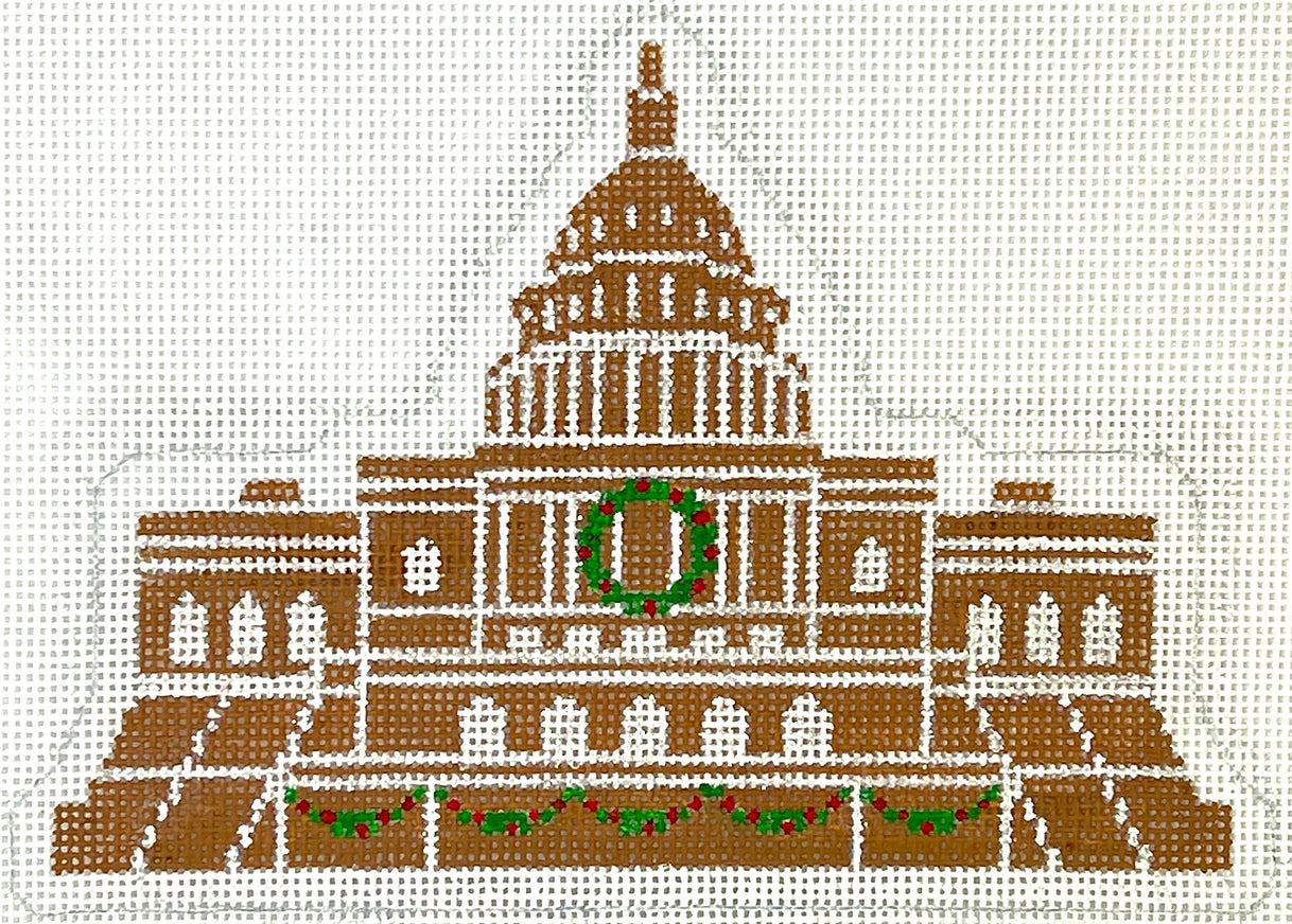 Kate Dickerson Christmas needlepoint canvas of the US Capital building in Washington D.C. made out of gingerbread with a Christmas wreath and garland decorating it