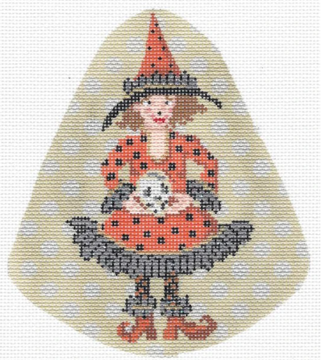 Kelly Clark Halloween needlepoint canvas of a witch wearing orange and black holding a skull