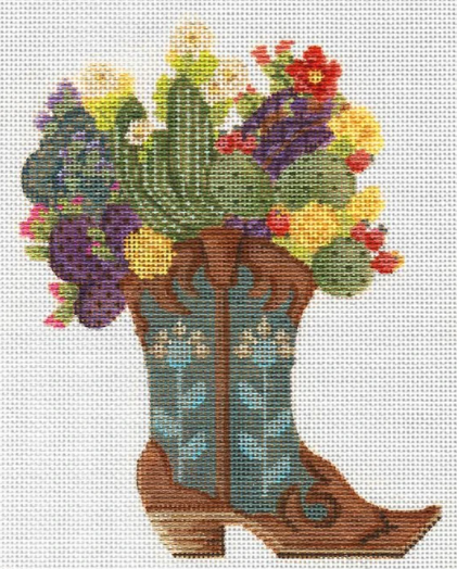 Kelly Clark needlepoint canvas of a cowboy boot filled with flowers and cactus plants for a southwestern feel