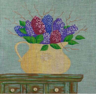 Kim Leo needlepoint canvas of a flower arrangement of a pitcher of lilacs