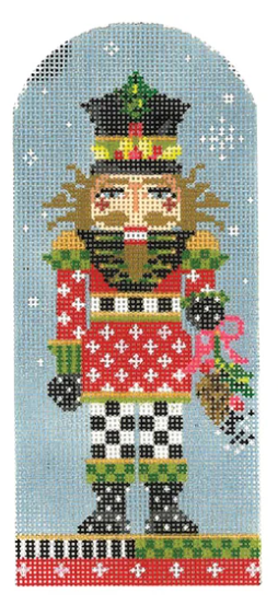 Kelly Clark needlepoint canvas of a Christmas nutcracker holding pine cones in the snow