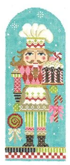 Kelly Clark Christmas needlepoint canvas of a nutcracker holding a cake, lollipop, and candy cane in the snow