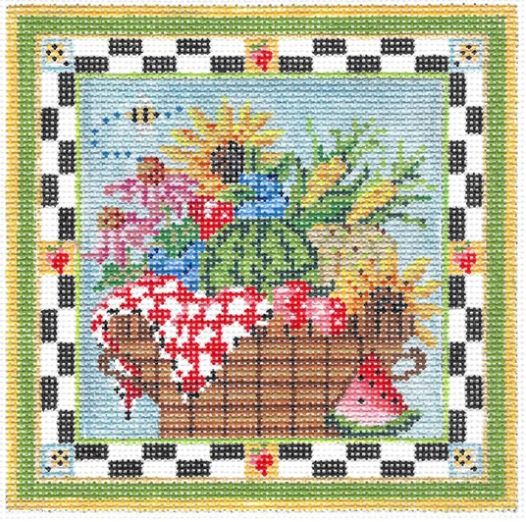 Kelly Clark needlepoint canvas of a summer picnic basket filled with flowers, corn, and summer harvests with a slice of watermelon and a bumblebee