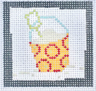 Pippin square needlepoint canvas of a yellow sand bucket with red circles and a beach shovel