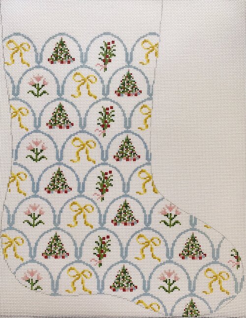 Riley Sheehey for Plum Stitchery needlepoint canvas Christmas stocking with scalloped pattern of yellow bows, Christmas trees, and flowers