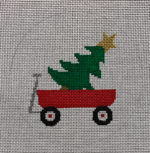 Suzie Vallerie for Vallerie Needlepoint Gallery round Christmas needlepoint canvas of a child's red Radio Flyer wagon with a Christmas tree inside